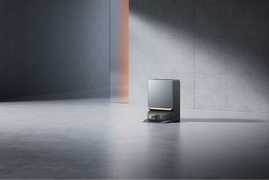 Black Narwal Flow 2 robot vacuum and large docking station in a modern living room